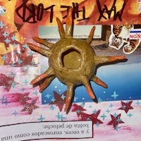 a piece of paper with a sun on it