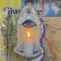 an image of a candle holder with an eye on it